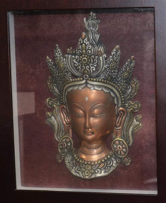 A copper relief and Thai princess in light up display case